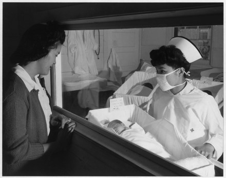 Nurse Aiko Hamaguchi, mother Frances Yokoyama, baby Fukomoto, Manzanar Relocation Center, California 