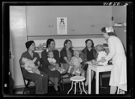 At the well baby clinic at the Cairns General Hospital at the FSA (Farm Security Administration) farm workers' community. The well baby clinic meets once a week and babies are weighed, measured, and others given instructions as to their care, feeding, etc. Three of those babies were born at the Cairns Hospital. Eleven Mile Corner, Arizona