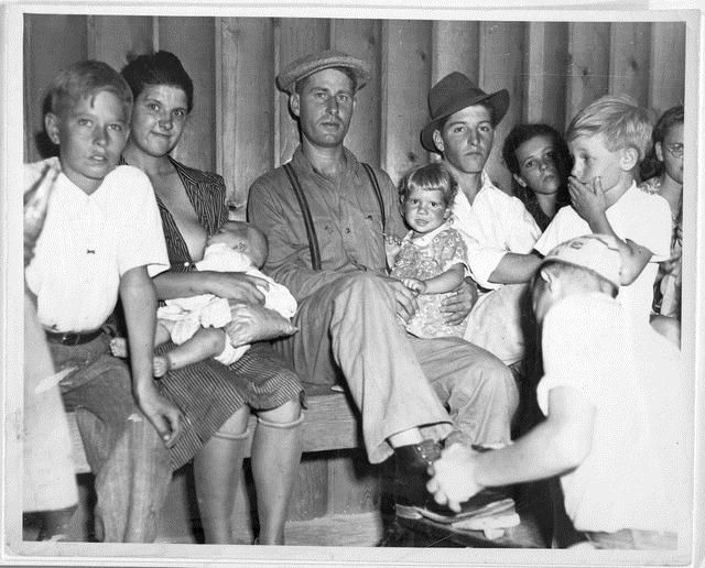 a) Part of Social Hour audience at Shafter Camp (handwritten on reverse); b) Todd’s favorite picture of an “Okie Family” in Shafter F.S.A. Camp. Nursing babies was the usual thing at camp “Socials.” (typed and attached to reverse)