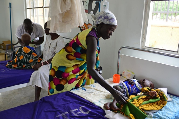  Country: South Sudan Year: 2014 Photographer: Christine Nesbitt title / Job name:  caption:      On 11 August, Nyabol Hion holds her 2-year-old daughter, Nyanmot Lam, at Al Sabbah Paediatric Hospital in Juba, the capital. “I travelled here by boat with my husband’s brother,” says Ms. Hion. “My three other children stayed with my husband in Walyar in Unity State." Her home was destroyed during the conflict, and she lived for a while in the bush after fleeing the fighting. Nyanmot’s illness began in April 2014, but she has been in hospital for only three days, receiving therapeutic milk every two hours for her malnutrition, as well as antibiotics to treat her diarrhoea and vomiting. “Nyanmot is not the only sick child I’ve seen,” say Ms. Hion. “Many children are sick, and many are passing away.” After Nyanmot’s treatment, they will return to Walyar. “My wish is for a good life and peace,” says Ms. Hion, who advises mothers that “if your child is sick, take the child to the hospital.” In early August 2014 in South Sudan, 1.1 million people have been displaced since resurgent conflict erupted in mid-December 2013. An estimated 588,222 of the displaced are children. Some 434,000 people have also sought refuge in neighbouring countries. UNICEF has appealed for US$151.7 million to cover emergency responses across the vital areas of nutrition; health; water, sanitation and hygiene; protection; education; multi-sector refugee response; and cholera response. By 5 August, 62 per cent remained unfunded. 