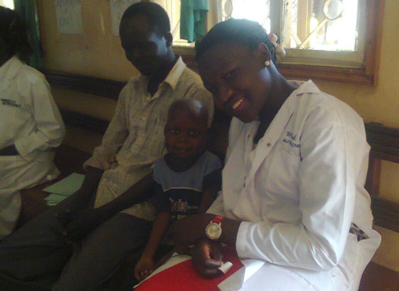 Kenneth and his father after he was discharged from the Nutrition unit in Lira district, Uganda